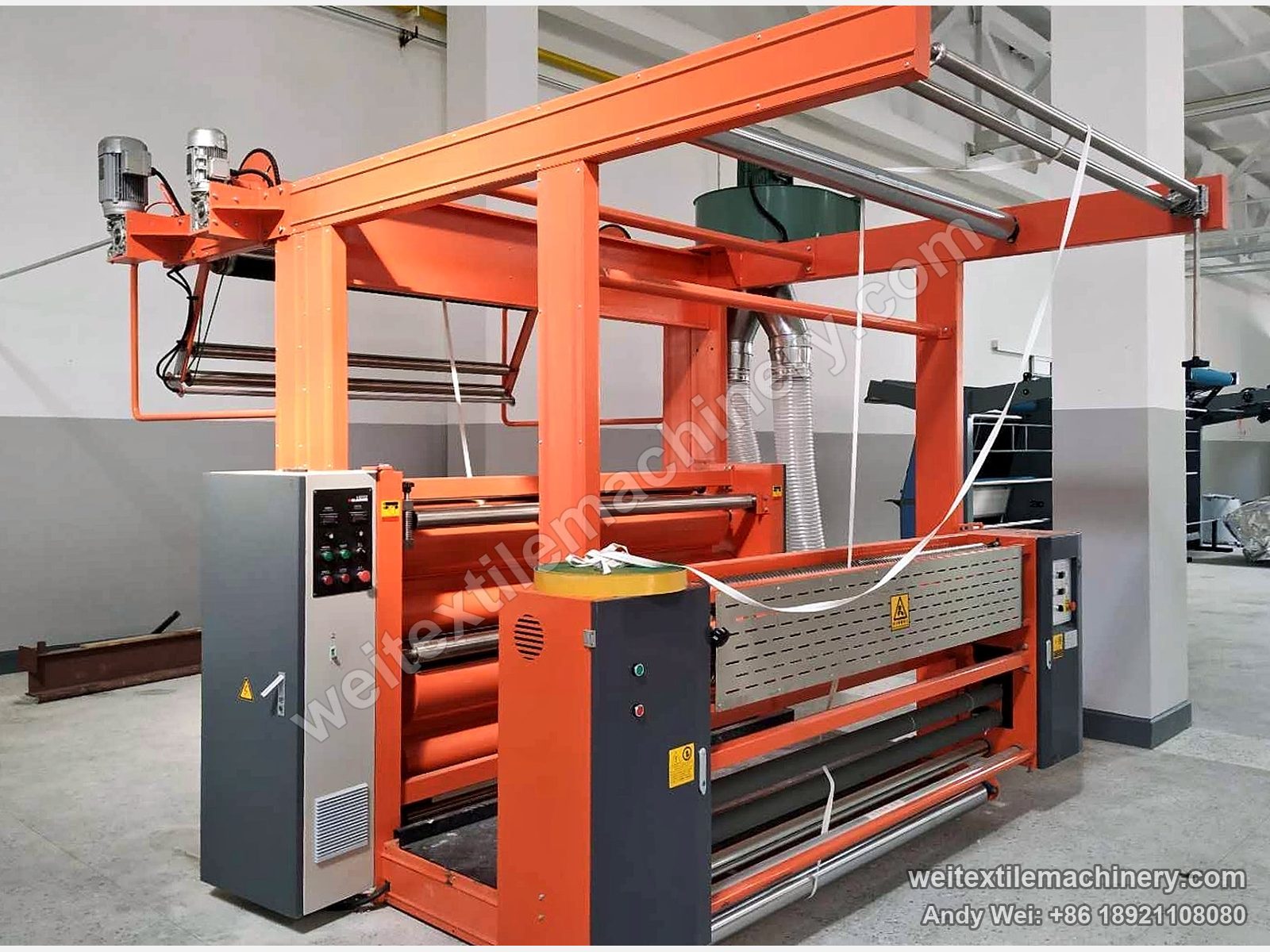 QL brushing machine with orange frame and dust extraction duct at UZWOOLENTEX