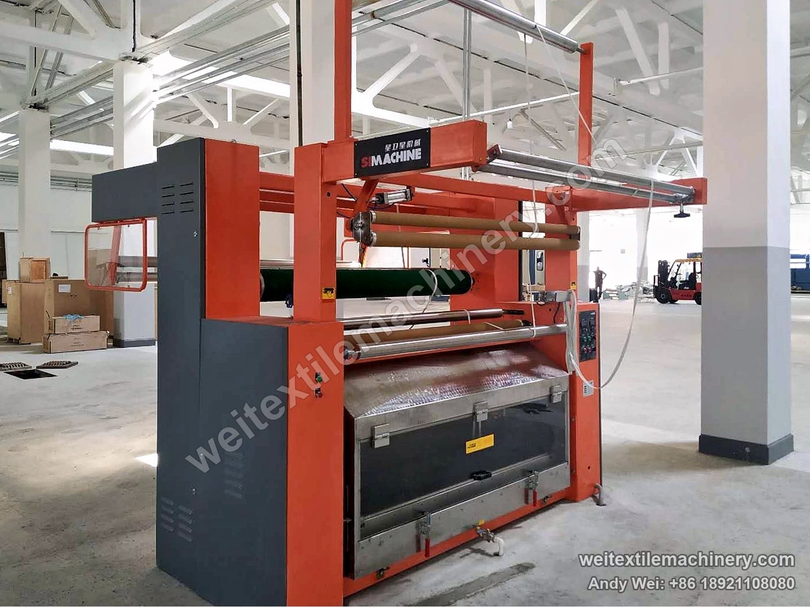 QL moistening machine in orange and grey at UZWOOLENTEX