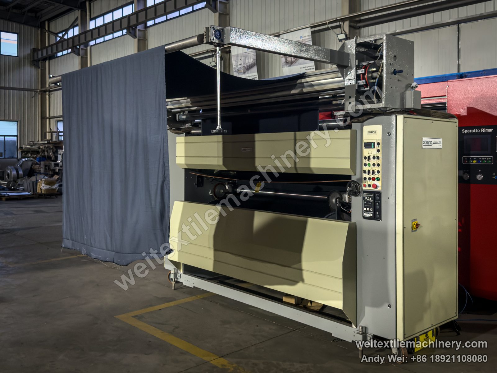 Used Corino Normatex Super-N pin-wheel weft straightener after QL rebuild, full view with fabric on the feed frame, Corino control box and cabinet