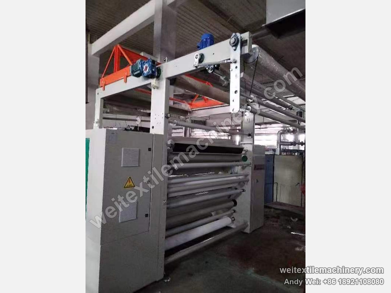 Used Danti Paolo DP7 shearing machine, three-quarter view with cabinet, blue geared motors and drive shaft on the top frame and lower rolls