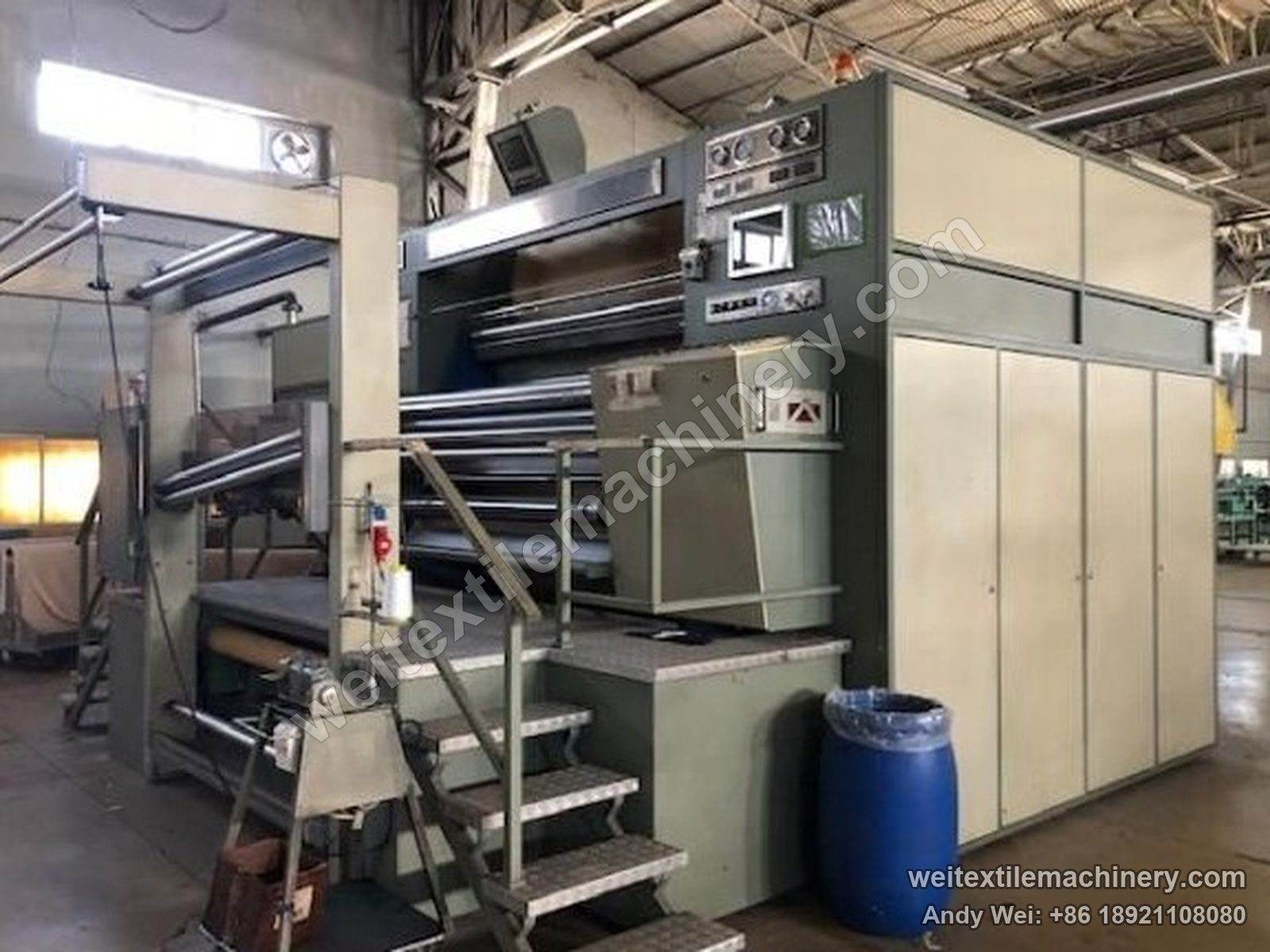 Used KD 1600 kier decatizing machine, full view with Biella Shrunk Process body, batching rolls, platform stairs and touch screen