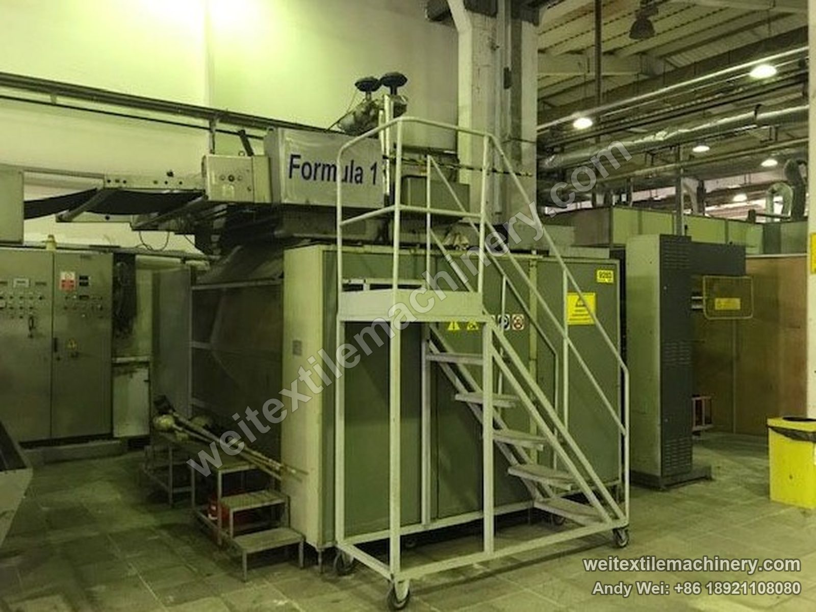Used KD Formula 1 Formula 1 moistening-calendering-decatizing machine, second unit, full view with platform stairs and cabinets