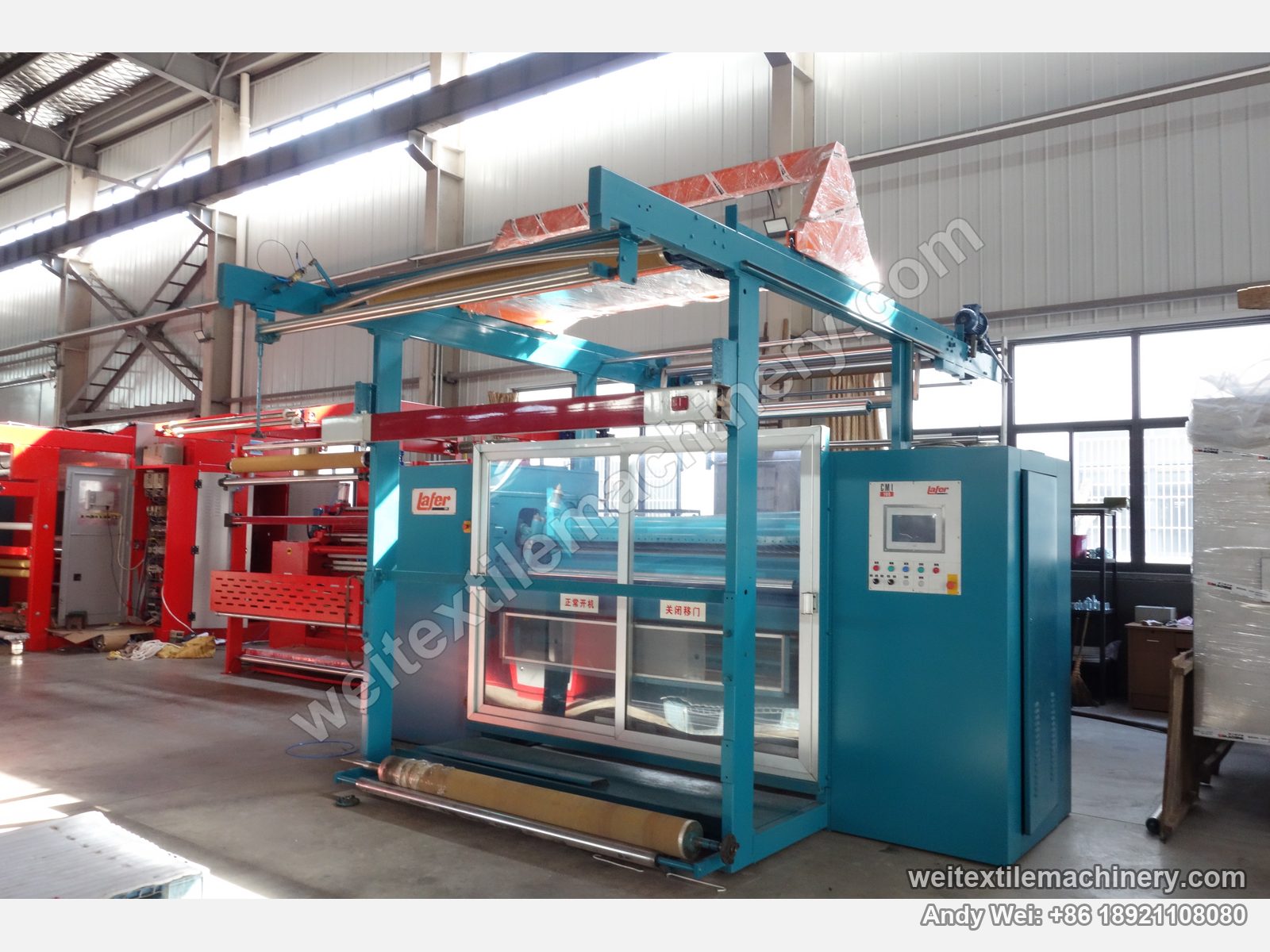 Used Lafer CMI 100 shearing machine (2.0 m) after QL rebuild, full view with blue body, overhead fabric frame, clear sliding doors and touch-screen cabinet