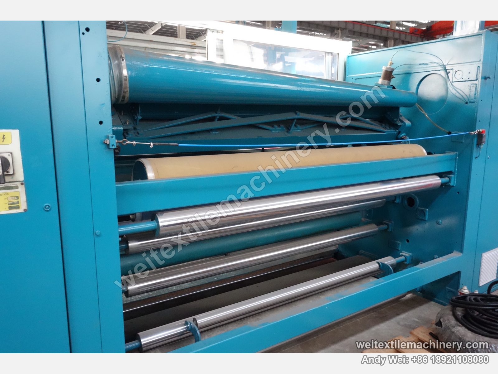 Used Lafer CMI 100 shearing machine (2.0 m), rear roll stack detail with film-wrapped guide rolls and pneumatic cylinder