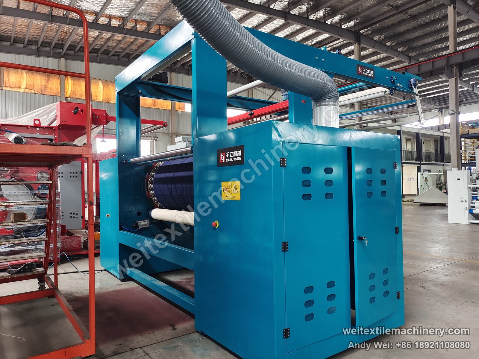 Used Lafer GRI 90 raising machine, side end with louvred blue hood doors carrying the QL plate and grey dust duct above