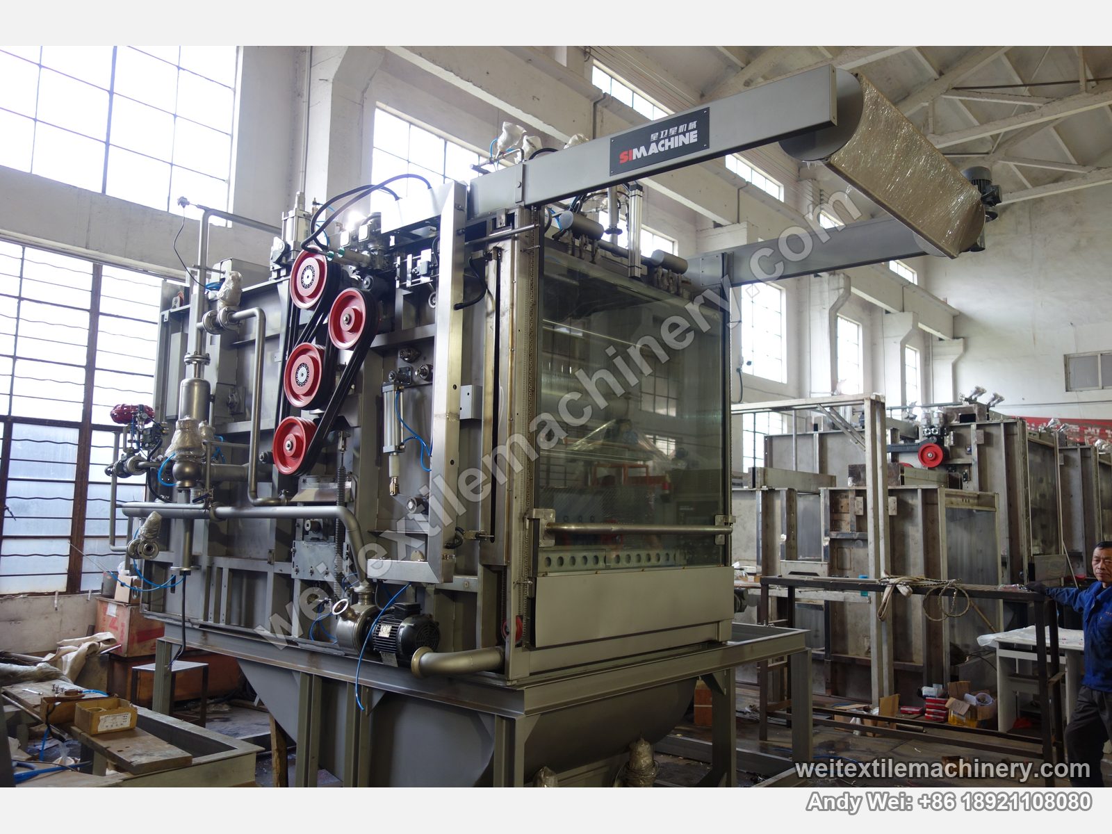 Used MAT Turbomat 2C rope scouring and milling machine at three-quarter angle with glass door, red drive pulleys and the SIMACHINE plate on the top arm