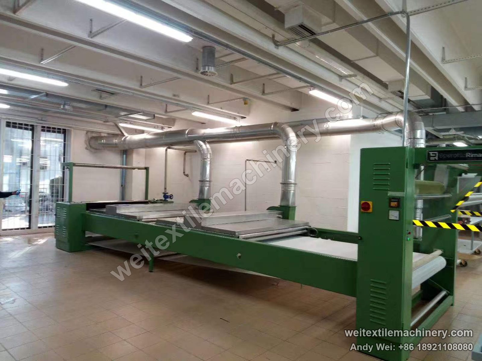 Used Sperotto Rimar belt-type steaming-shrinking machine, full view with green frame, long belt table, two steam-box covers, exhaust ducting and maker plate
