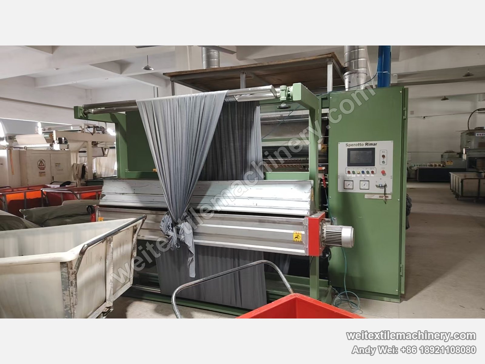Used Sperotto Rimar Multidecat 2.0 continuous decatizing machine, green body with grey fabric on the overhead rolls, touch-screen panel and trolleys