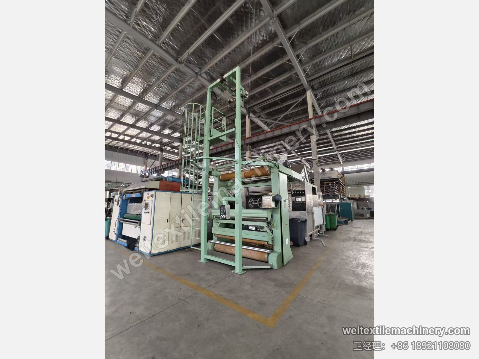 二手 Bianco 解捻开幅机侧前方全景，护笼爬梯、解捻塔与包膜辊组